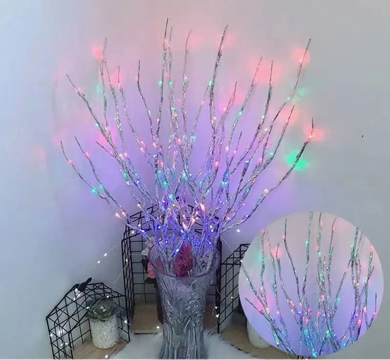 LED decorative tree light with silver artificial branches in vase base showing multiple colour options