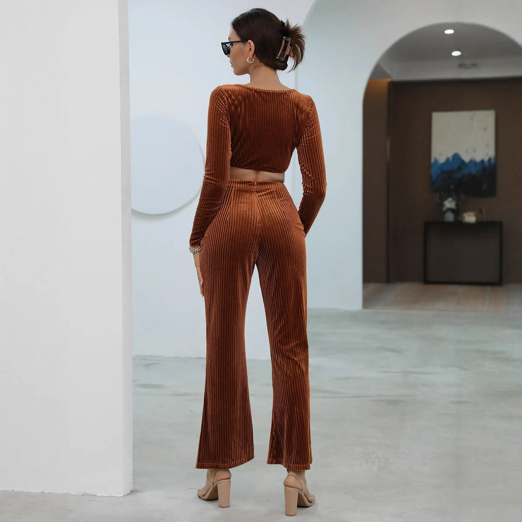 Women's caramel coloured sweater set with long sleeves and matching trousers on hanger