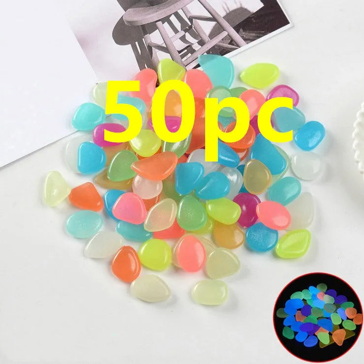 Luminous fluorescent aquarium and garden pebbles in mixed colours including dark purple, yellow, light blue, pink, orange