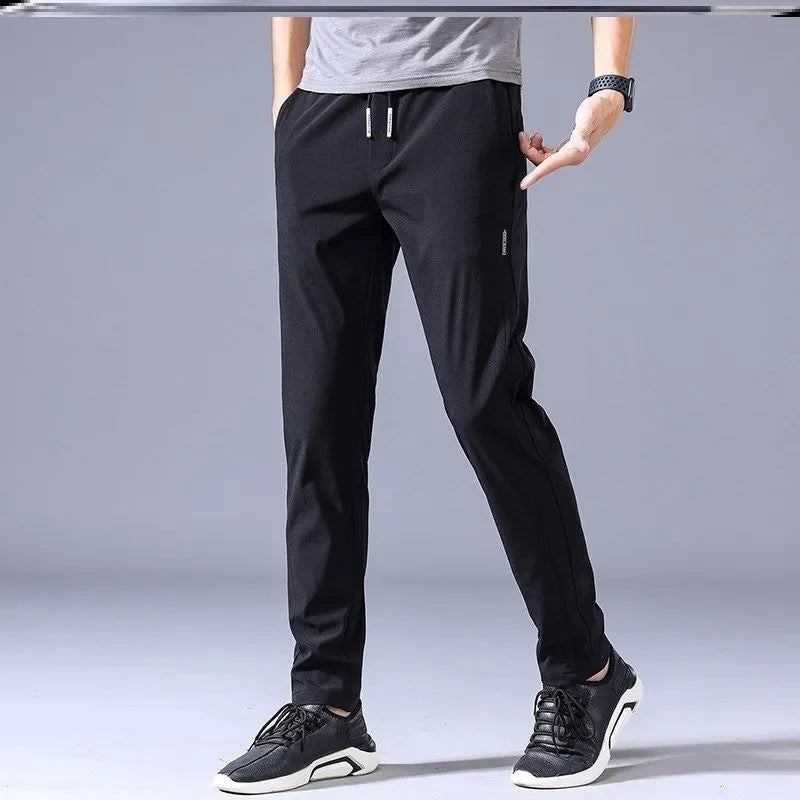 Men's drawstring trousers Korean version loose straight leg sweatpants in khaki colour on model