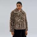 Women's leopard print coat with buckle lapel fastening on a hanger