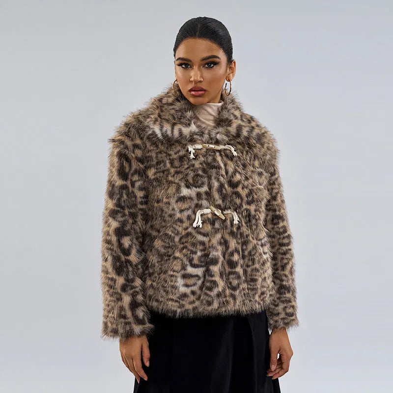 Women's leopard print coat with buckle lapel fastening on a hanger