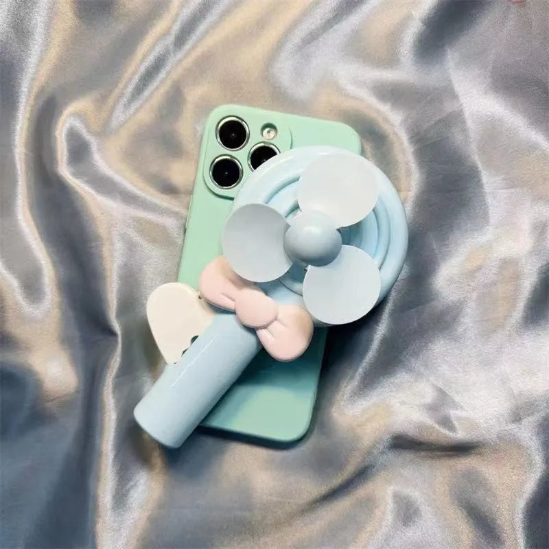 Lollipop hand fan drop-resistant soft TPU phone case in cyan and pink for iPhone models 6 to 15 Pro Max.
