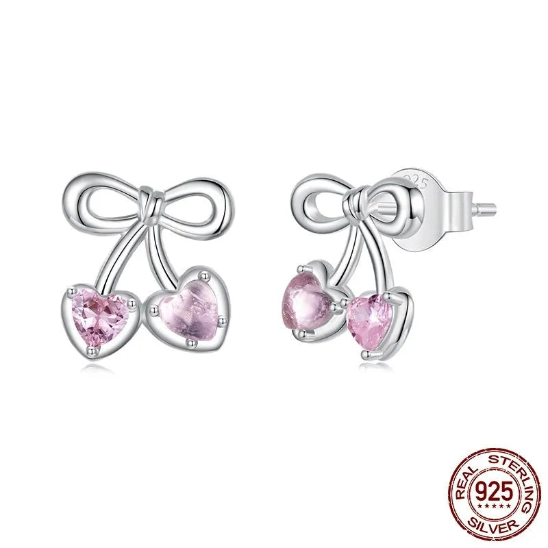 Sweet cherry stud earrings in 925 sterling silver with heart silhouette on light background