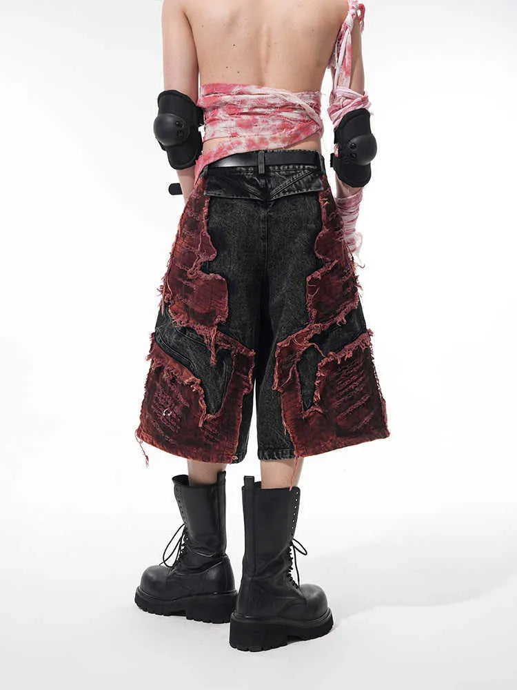 Distressed denim cropped pants with wide-leg cut and mid-high waist in cotton fabric
