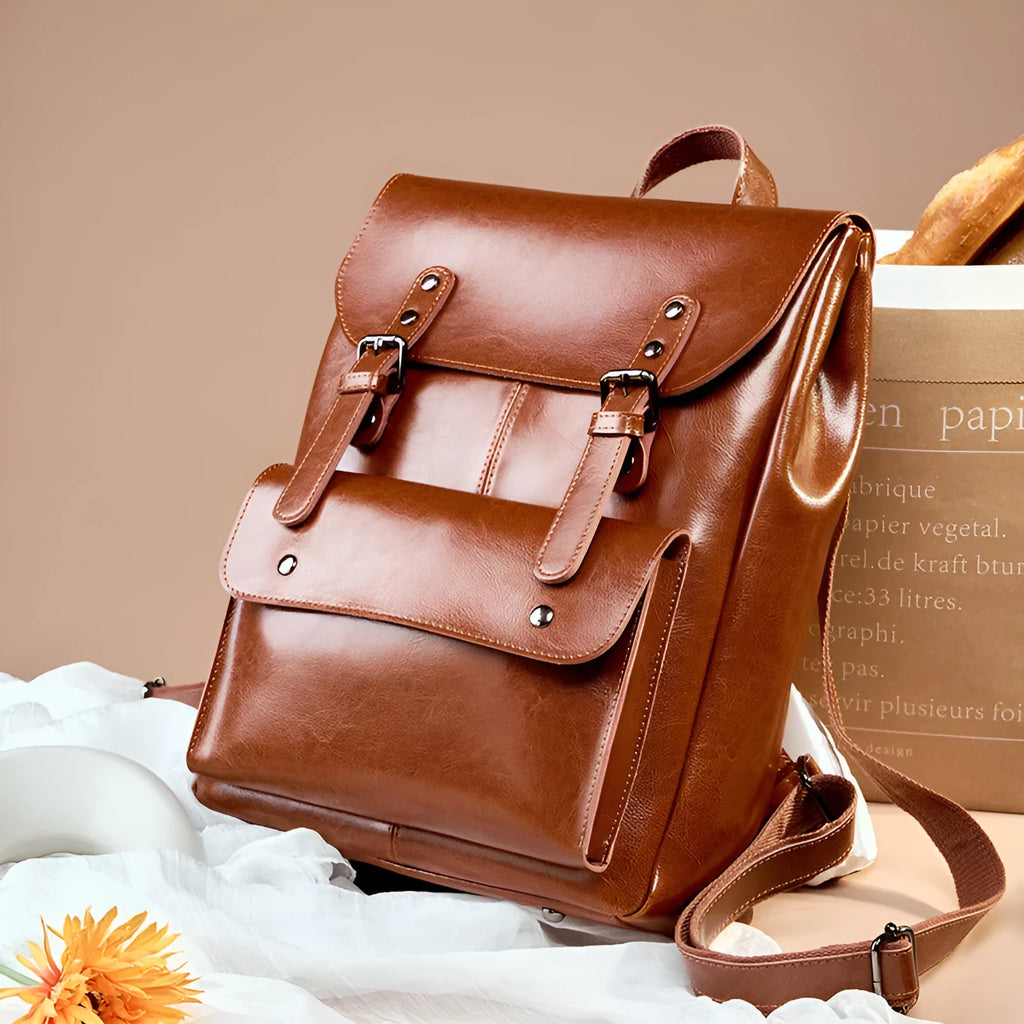 Genuine two-layer cowhide leather computer backpack for women in black, brown, or coffee.
