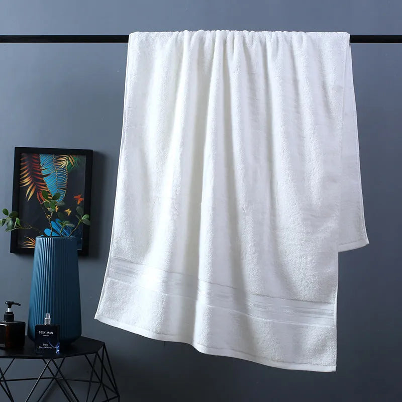 Three-piece cotton bath towel set in floral colours showing bath towel, hand towel and face cloth with optional logo printing