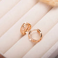Rose gold copper leaf hollowed out earrings with a heart shape design.