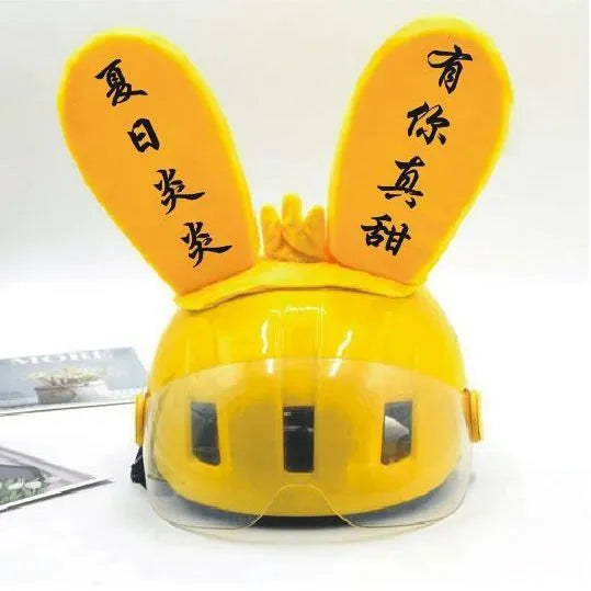 Rabbit Glow helmet decoration with Velcro bottom on a ski helmet, shown in blue LED style.