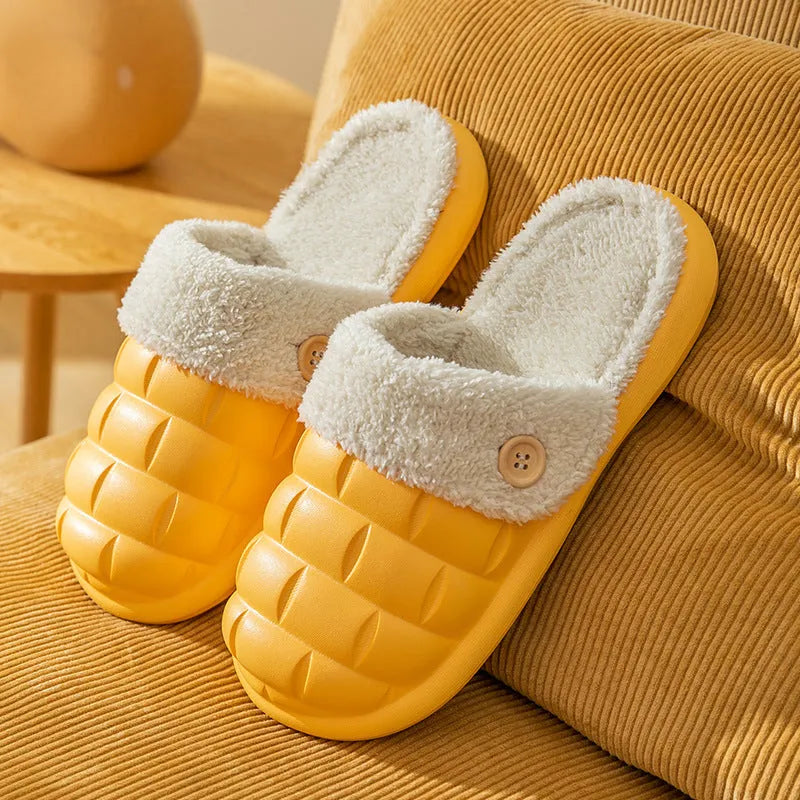 Plaid detachable slippers for women with plush lining and EVA sole in pink, shown on a wooden floor.