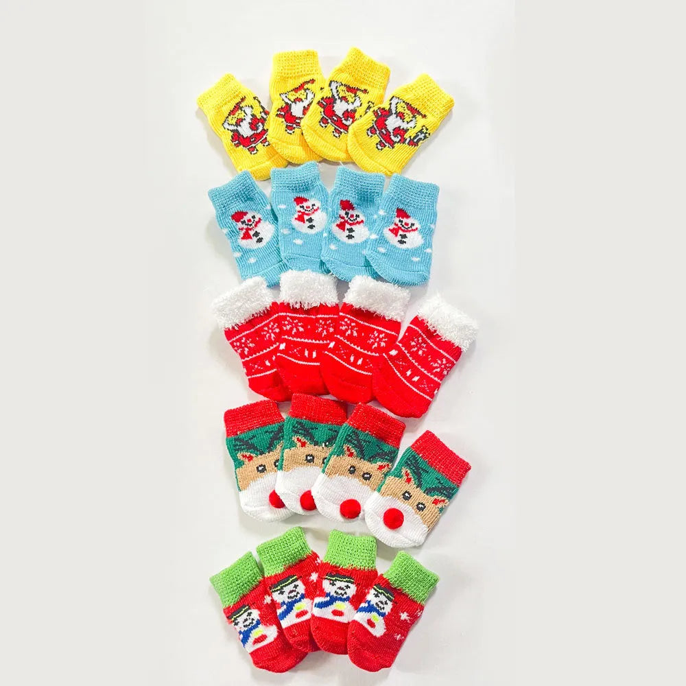 Set of four Christmas dog socks with Santa Claus and elk cartoon patterns in blue and red colours