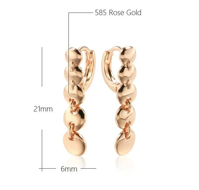 Long round gold retro earrings with woven copper texture, shown as a pair.