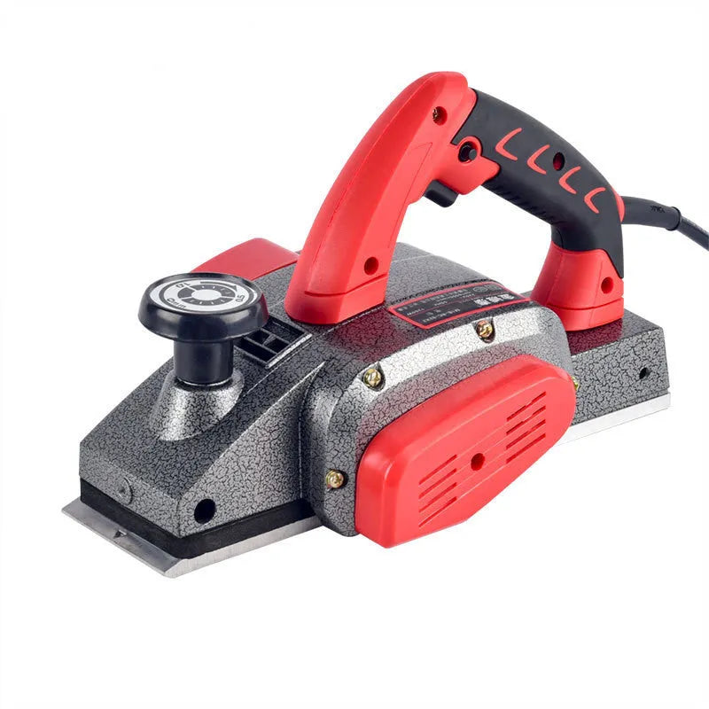 Red desktop electric wood planer with aluminium body, showing 82mm planing width and depth adjustment controls