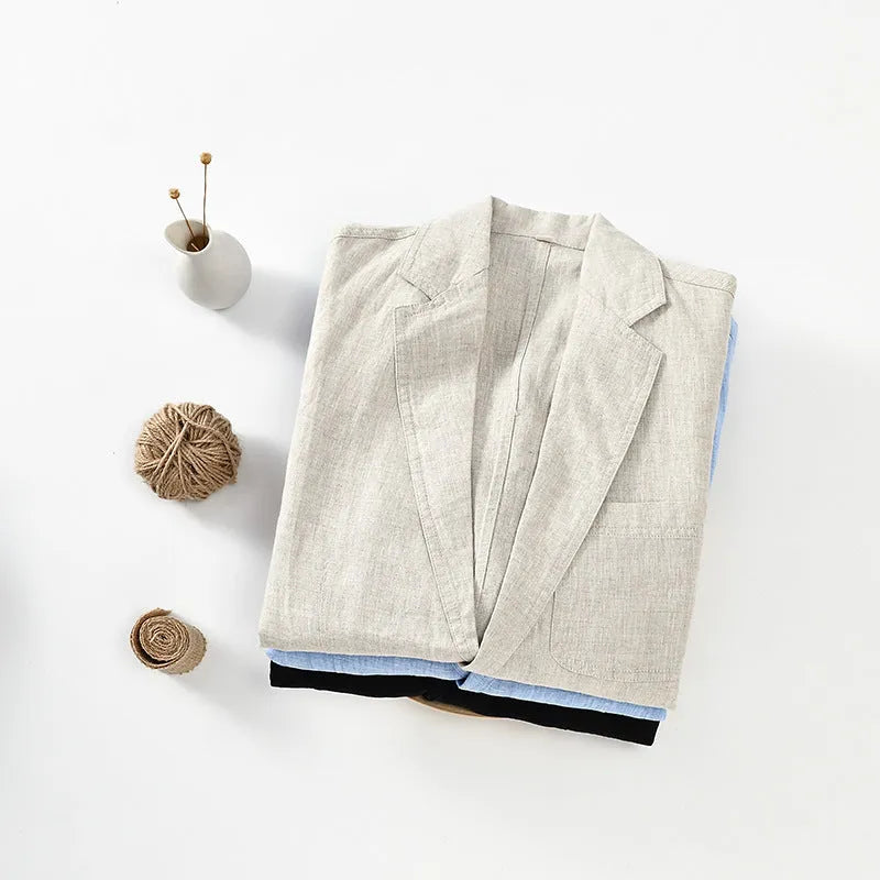 Men's solid colour linen suit coat with a stick pocket on a hanger.