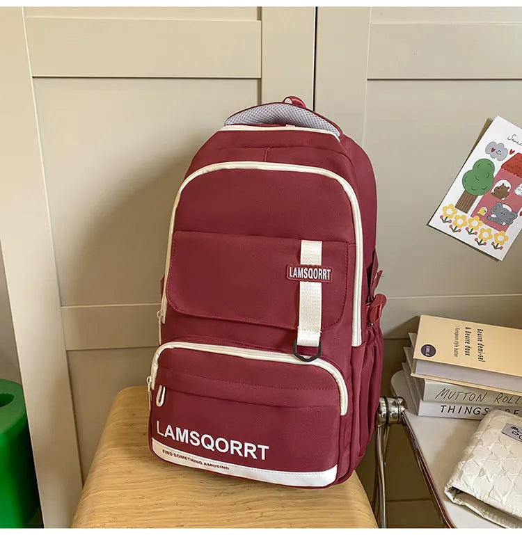 High school student backpack in waterproof nylon with curved shoulder straps and under 20L capacity