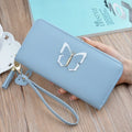 Women's long zip wallet in black PU leather with zipper closure and compact dimensions