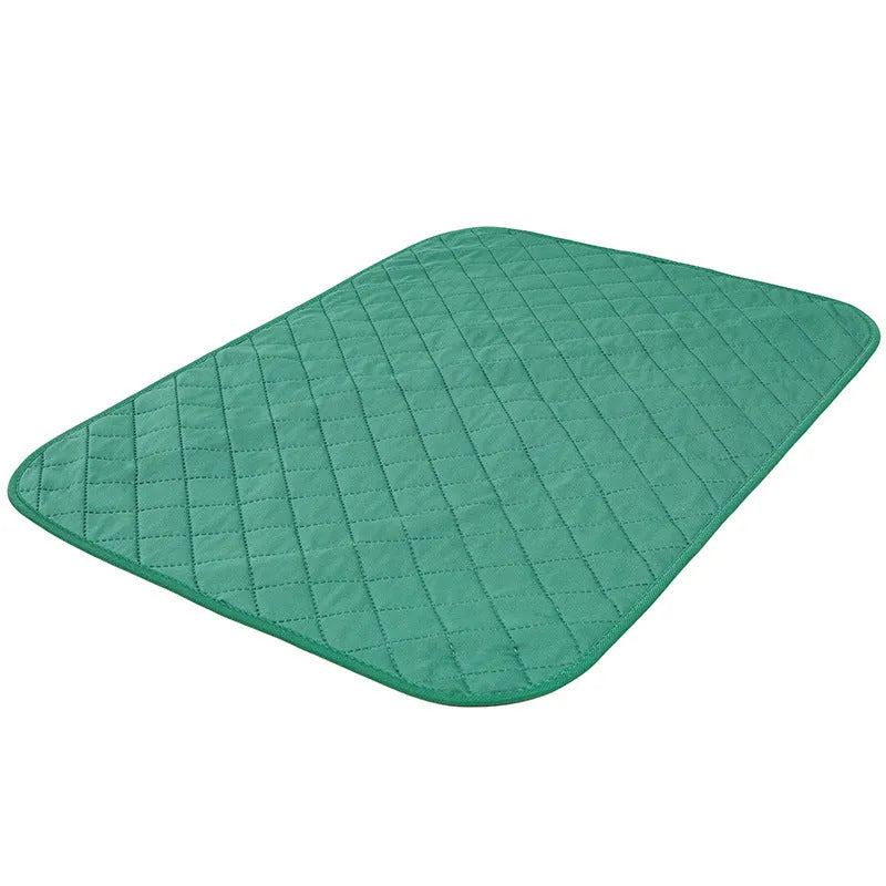 Natural bamboo fibre pet training pad in green colour, moisture-proof and deodorant, shown on a floor
