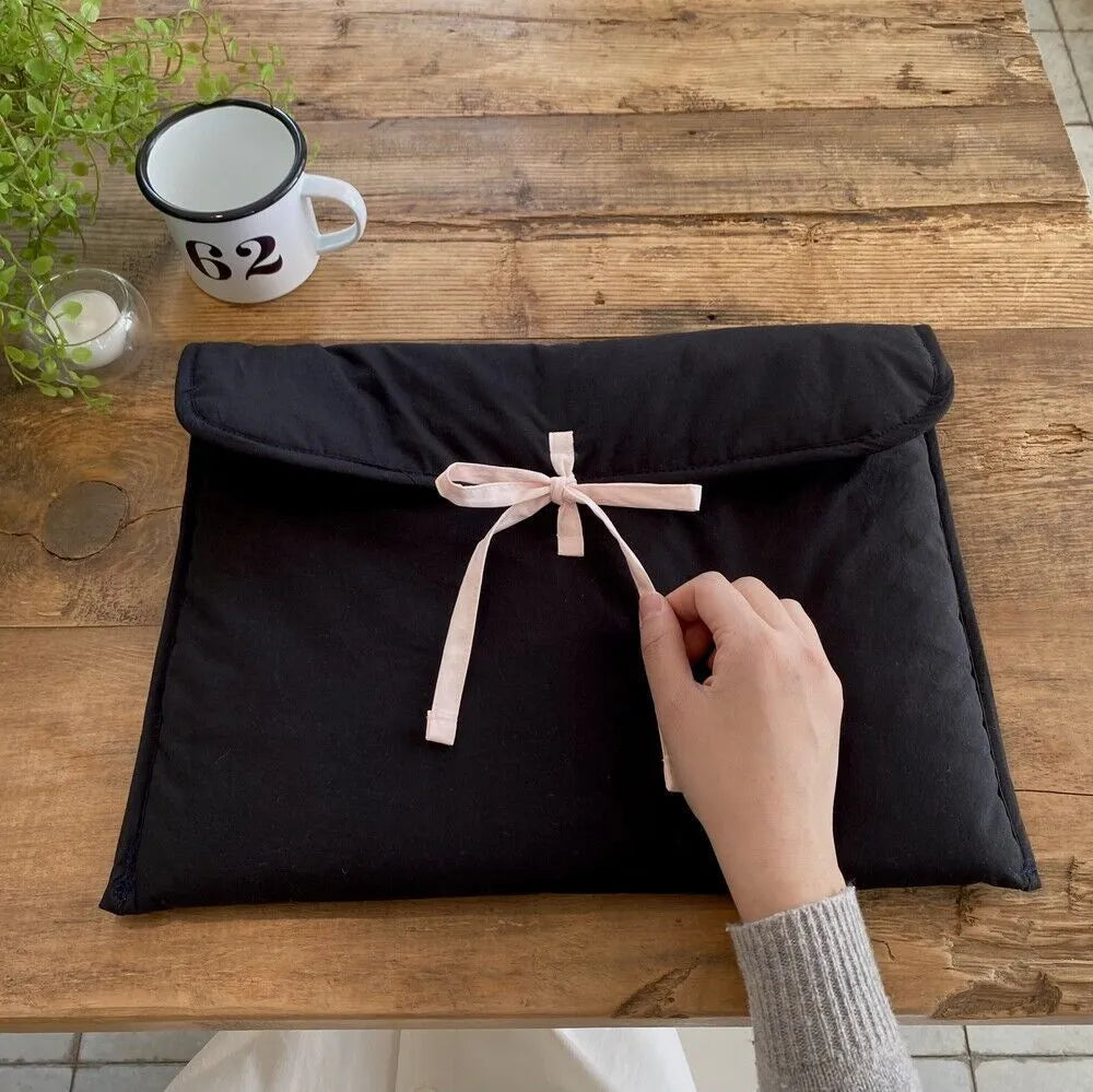 Women's ballet style bow quilted computer bag in black nylon with striped lining, fits 11-14 inch laptops