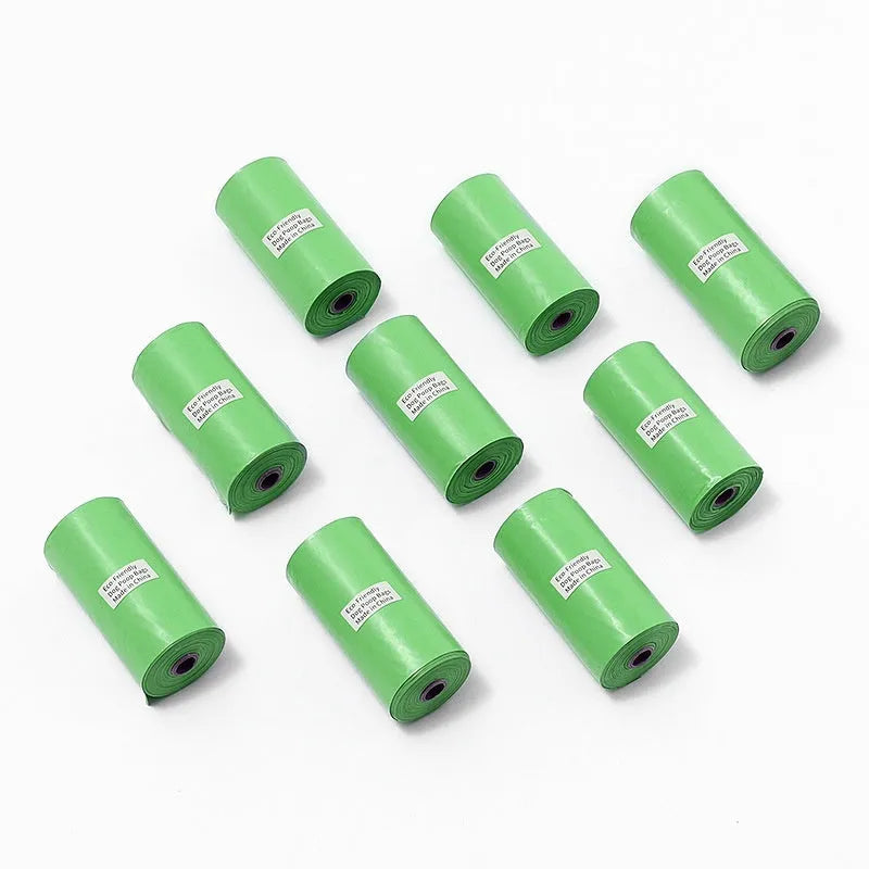 Green roll of EPI degradable thickened pet poop bags next to a green dispenser unit on a white background.