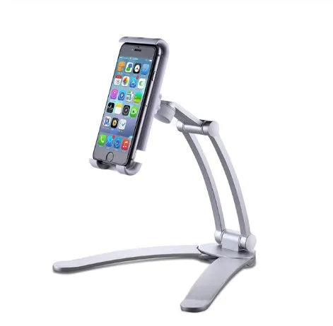 Silver aluminium alloy desktop tablet stand with adjustable holder and white mounting base on a wooden table.