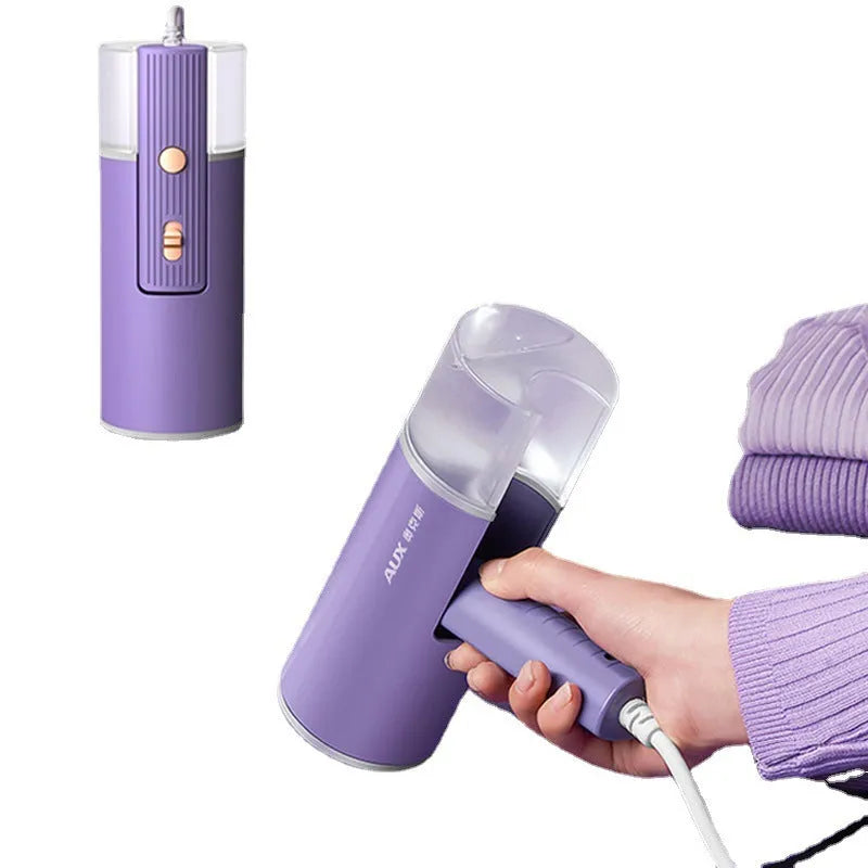 Foldable handheld clothes steamer in grey lotus root purple on a table.