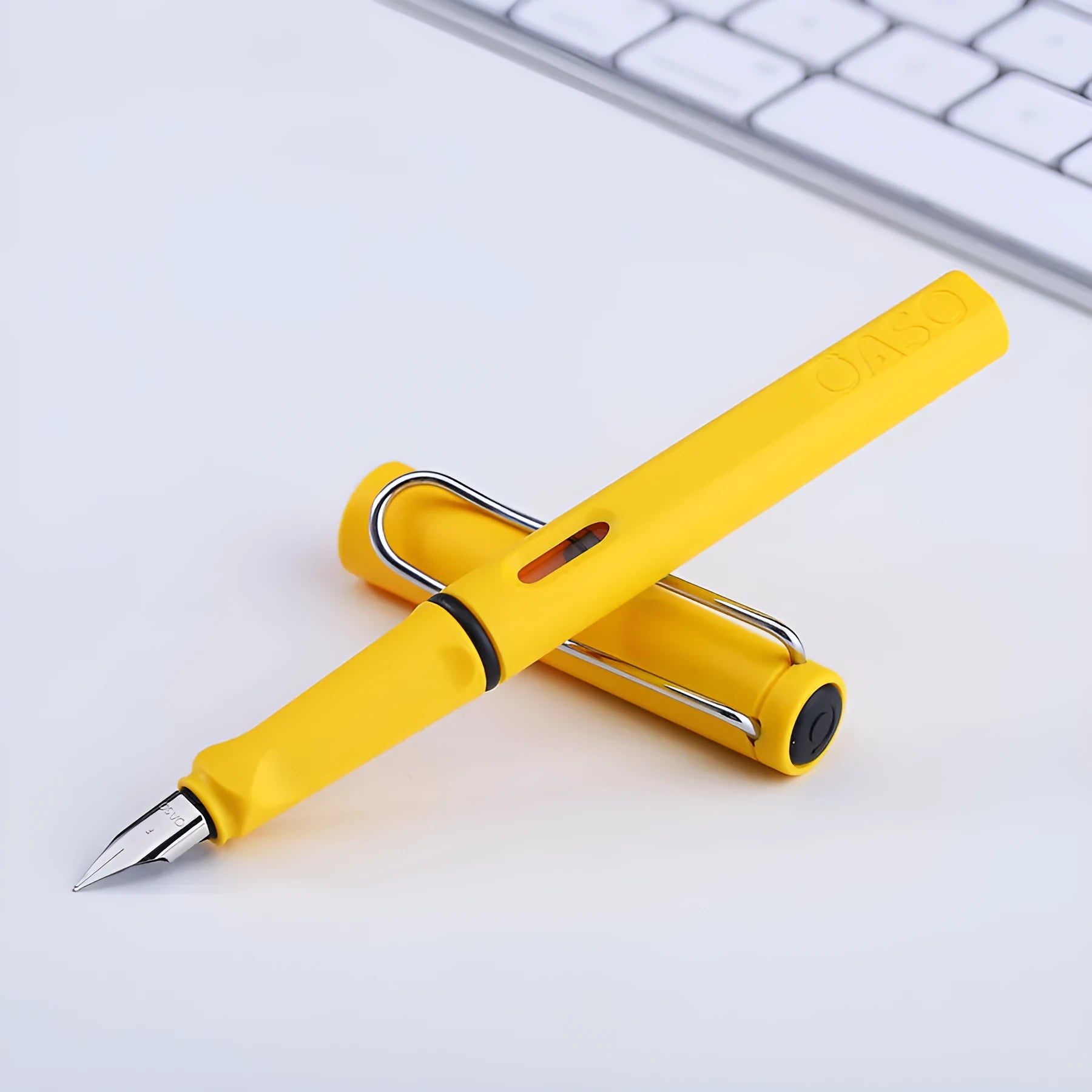 Ink sac pen with 0.5mm steel nib in red, yellow, green, blue or black plastic body