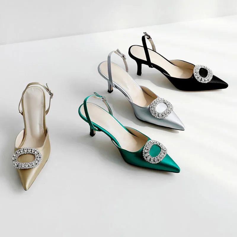 Red satin rhinestone high heel pump with pointed toe and buckle strap on stiletto heel