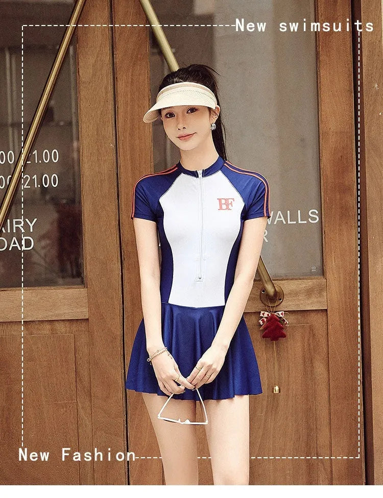Ladies conservative sports one-piece swimsuit in a colour-matching pattern, shown on a model.