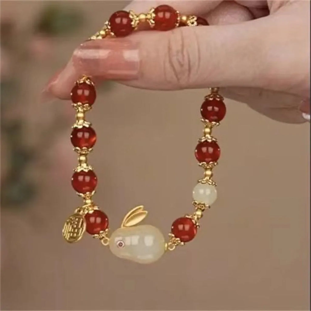 Coloured glass bracelet with rabbit motif in national style design for unisex wear