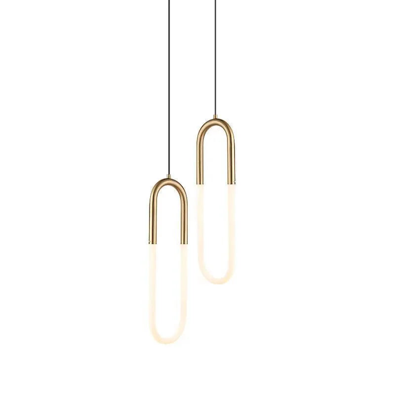 Nordic minimalist U-shaped bedside chandelier with a white shade on a pendant cord.