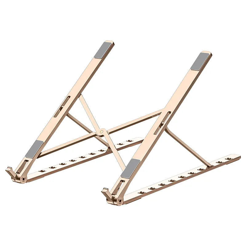 Folding flat aluminium alloy laptop bracket stand in silver with silicone pads, set at an angled position on a desk