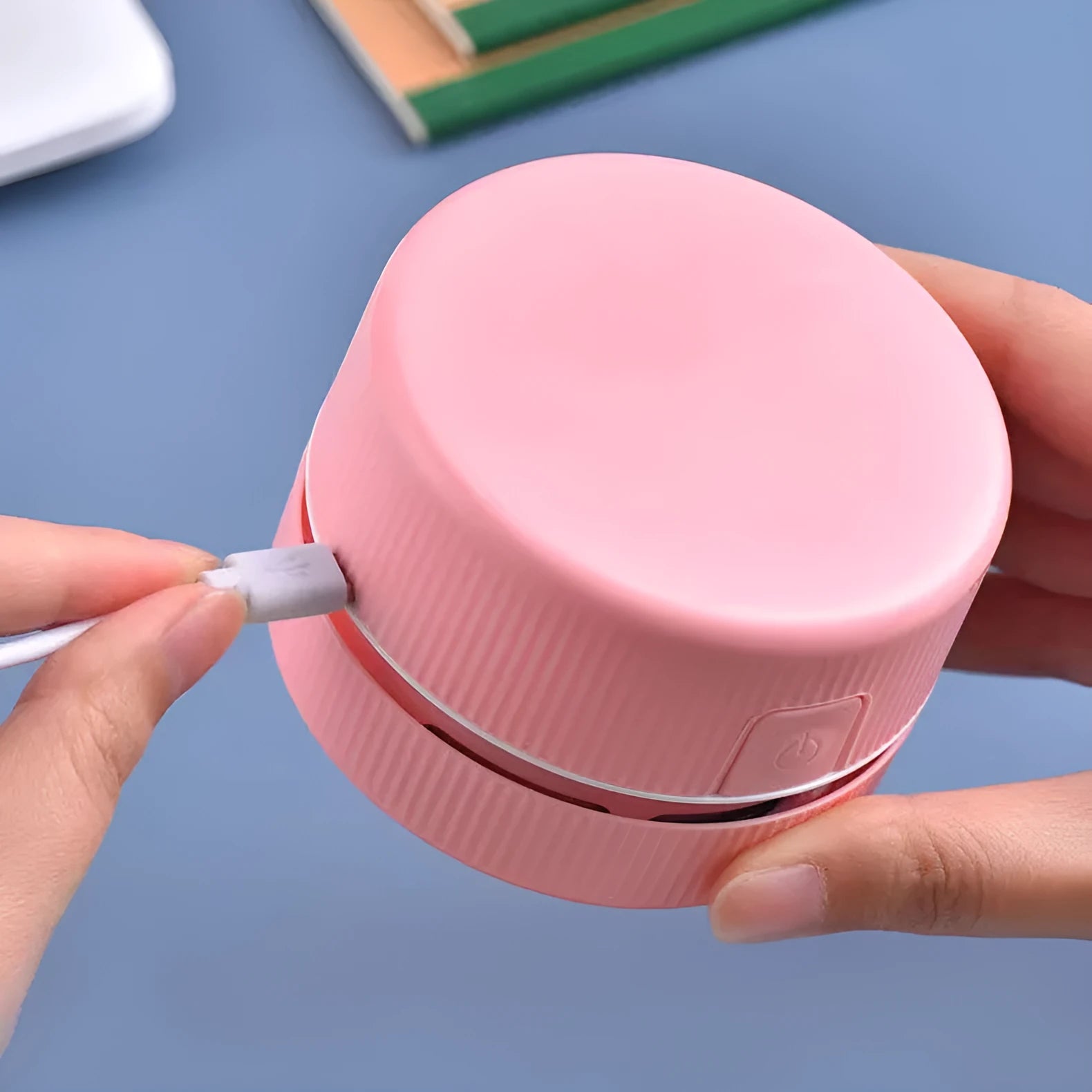 Portable mini desktop vacuum cleaner in blue colour with handheld design