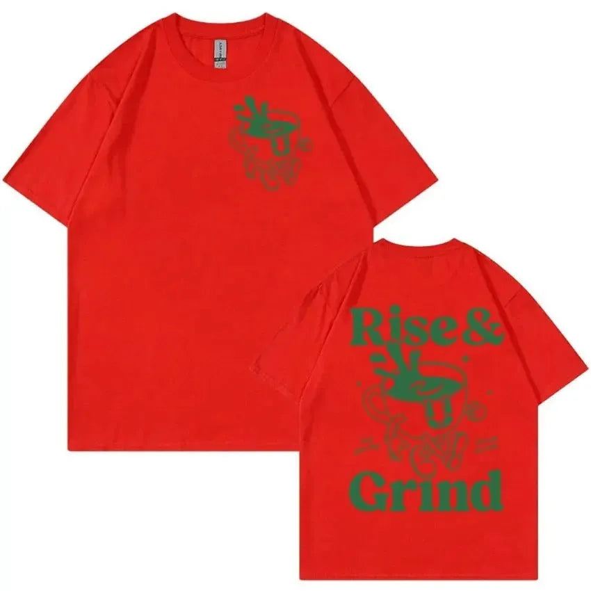 A loose-fit linen T-shirt with a Rise And Grind Green Coffee cartoon print, shown in one of ten available colours.