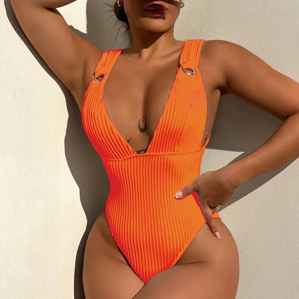 A solid colour one-piece swimsuit for women, shown in black, white, green, and orange colour options.