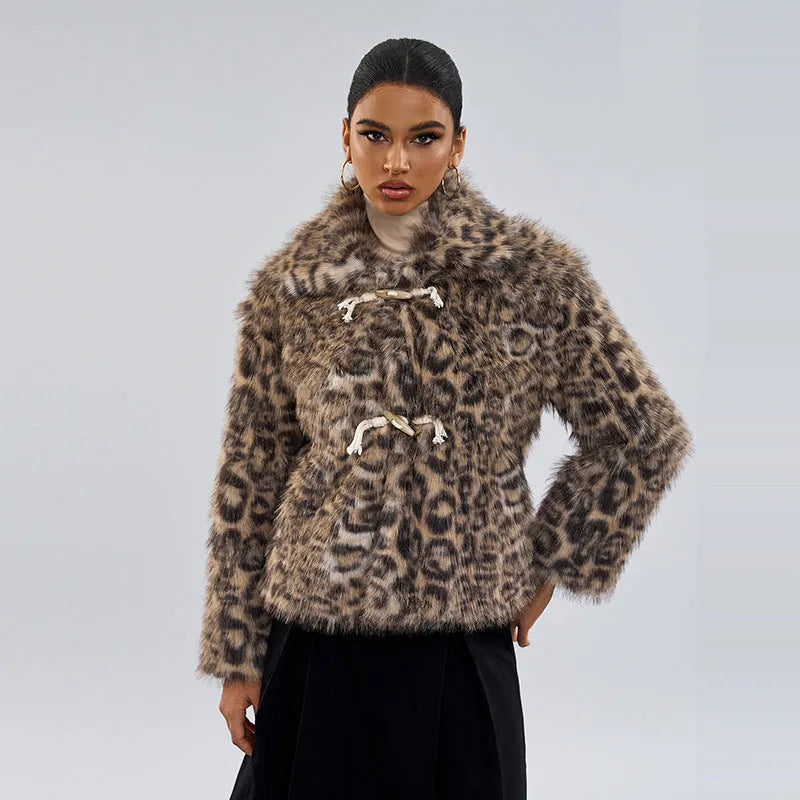 Women's leopard print coat with buckle lapel fastening on a hanger