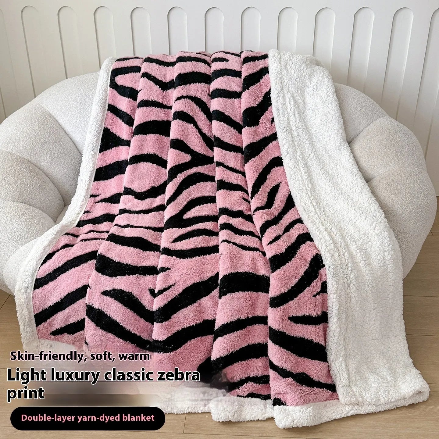 Double-layer taffeta blanket with woven leopard print pattern draped over sofa