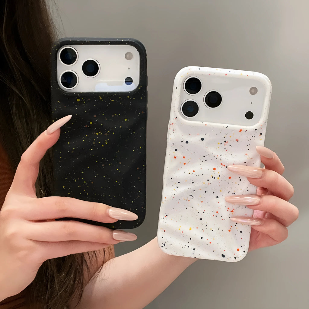 TPU phone case with splash ink pattern in black fitted on an iPhone showing the camera cutout