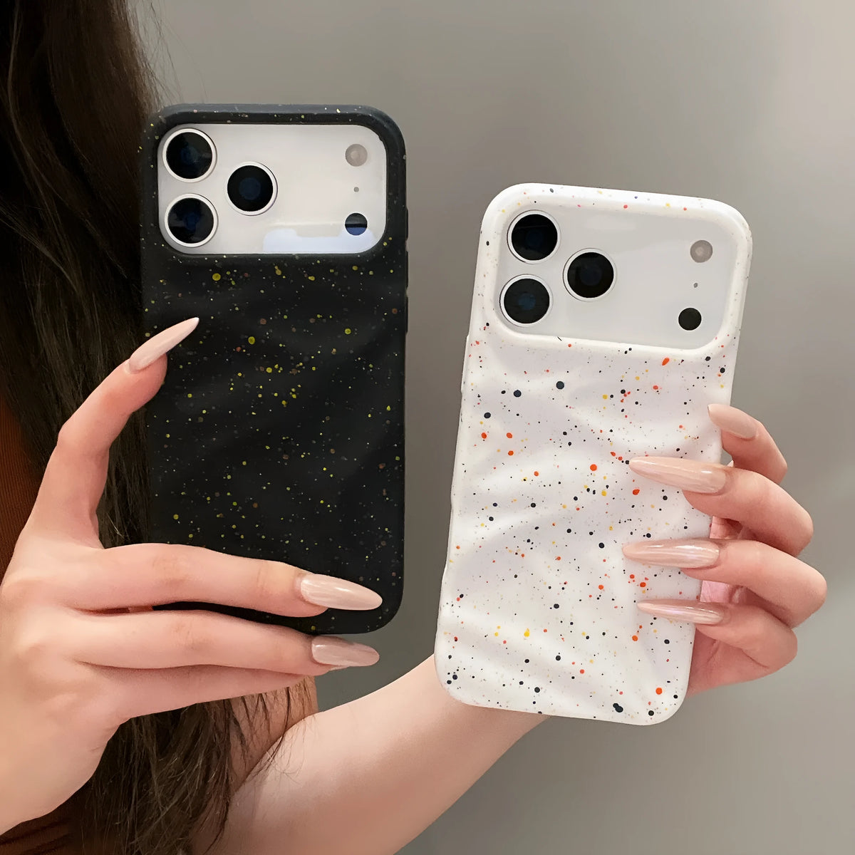 TPU phone case with splash ink pattern in black fitted on an iPhone showing the camera cutout