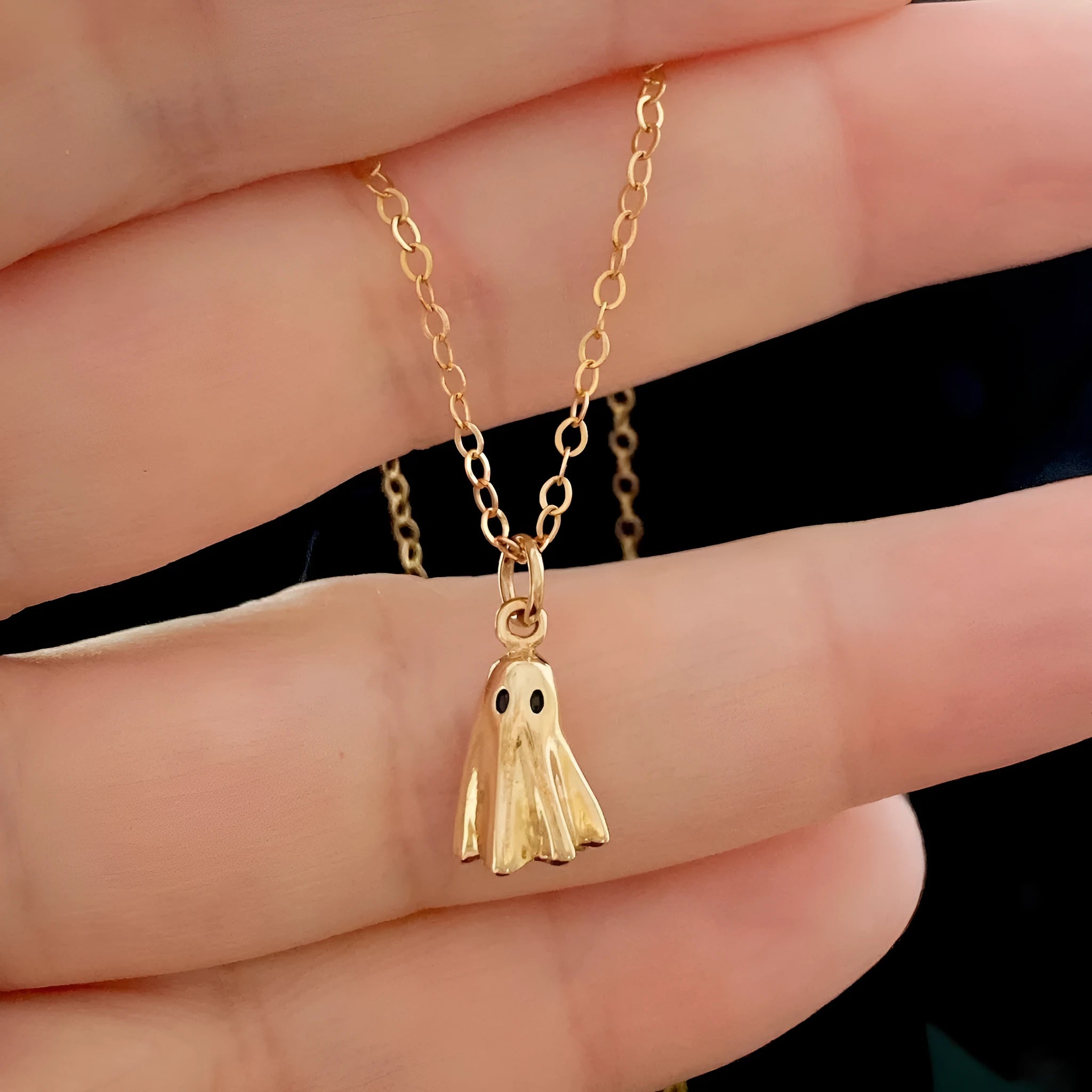 Ghost pendant necklace on a twisted stainless steel chain, shown in Cable, Figaro, and Mini Staple style options.