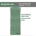 Single-size portable inflatable camping mattress in grey on a tent floor