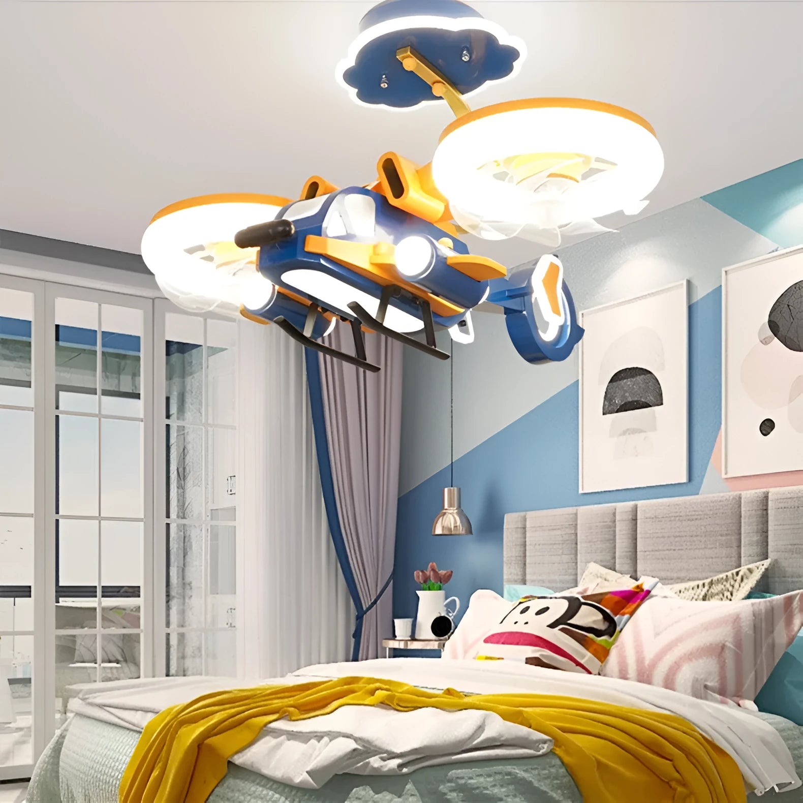 Modern ceiling fan with light, showing metal blades and a white acrylic lampshade, remote control beside it.