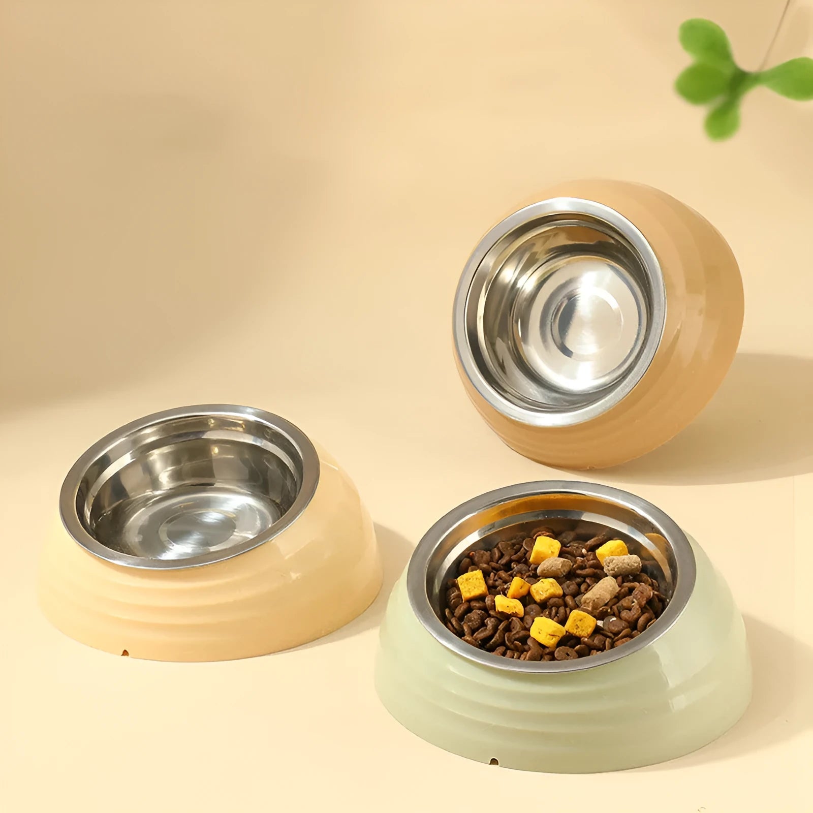 Stainless steel cat bowl on a plastic base in a choice of beige, brown, or light green.