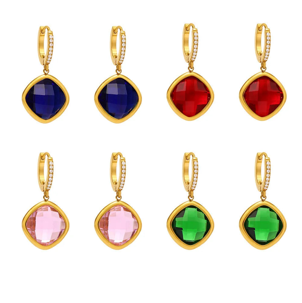 Mioli transparent cut Czech glass geometric square stud earrings in gold tone with blue zircon centre stone on white background