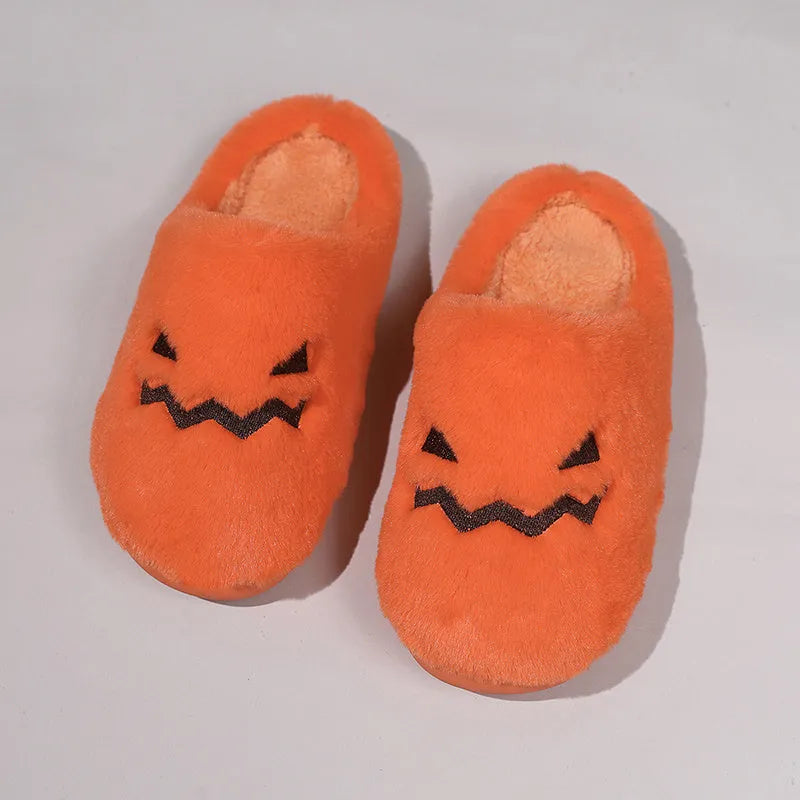 Orange pumpkin-shaped coral velvet plush slippers with a flat PVC sole.