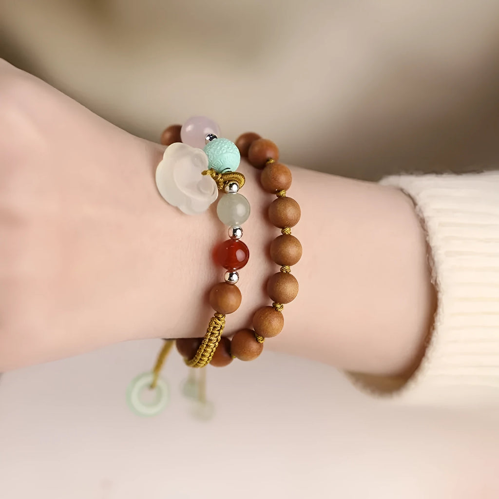 Women's hand-woven ebony bracelet with traditional ruyi pattern and double ring closure