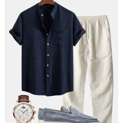 Men's slim-fit short-sleeved shirt with stand collar and digital print, shown with matching pants, shoes, and watch.