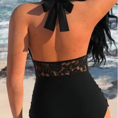 Black polyester patchwork backless tight-fitting one-piece swimsuit on display