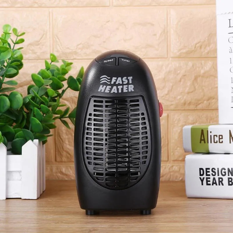 Black mini portable electric heater with digital display and a rotating plug on a white background.