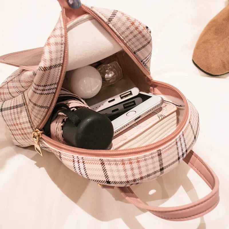 A diagonal one shoulder phone bag in synthetic PU leather, shown in a colour selection.