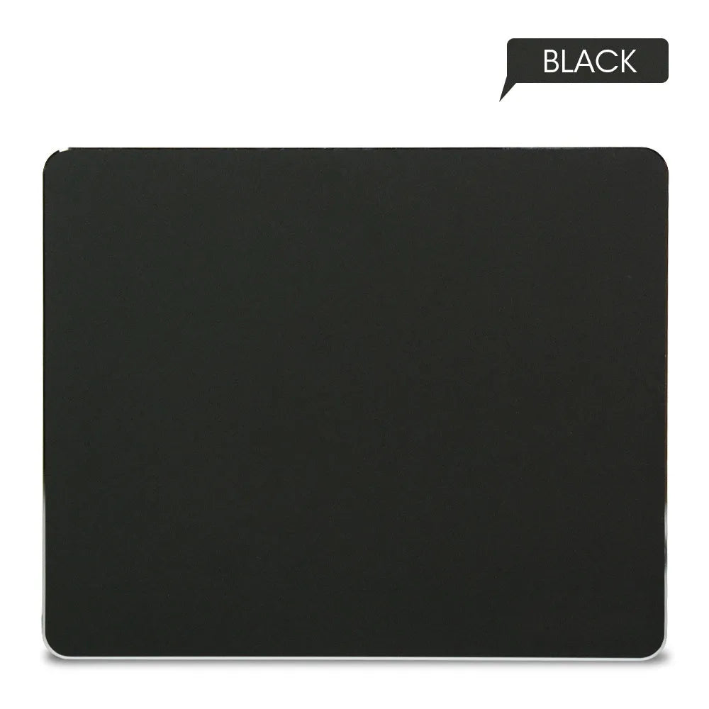 Aluminium alloy double-sided mouse pad in black finish on a desk for gaming or office use